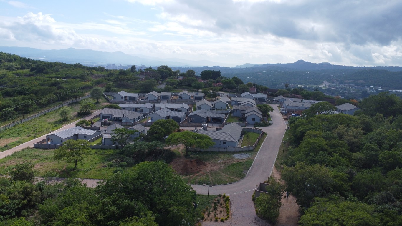 Aerial view of Intaba Estate, a secure residential estate near Nelspruit with serviced stands and homes set against a mountain backdrop